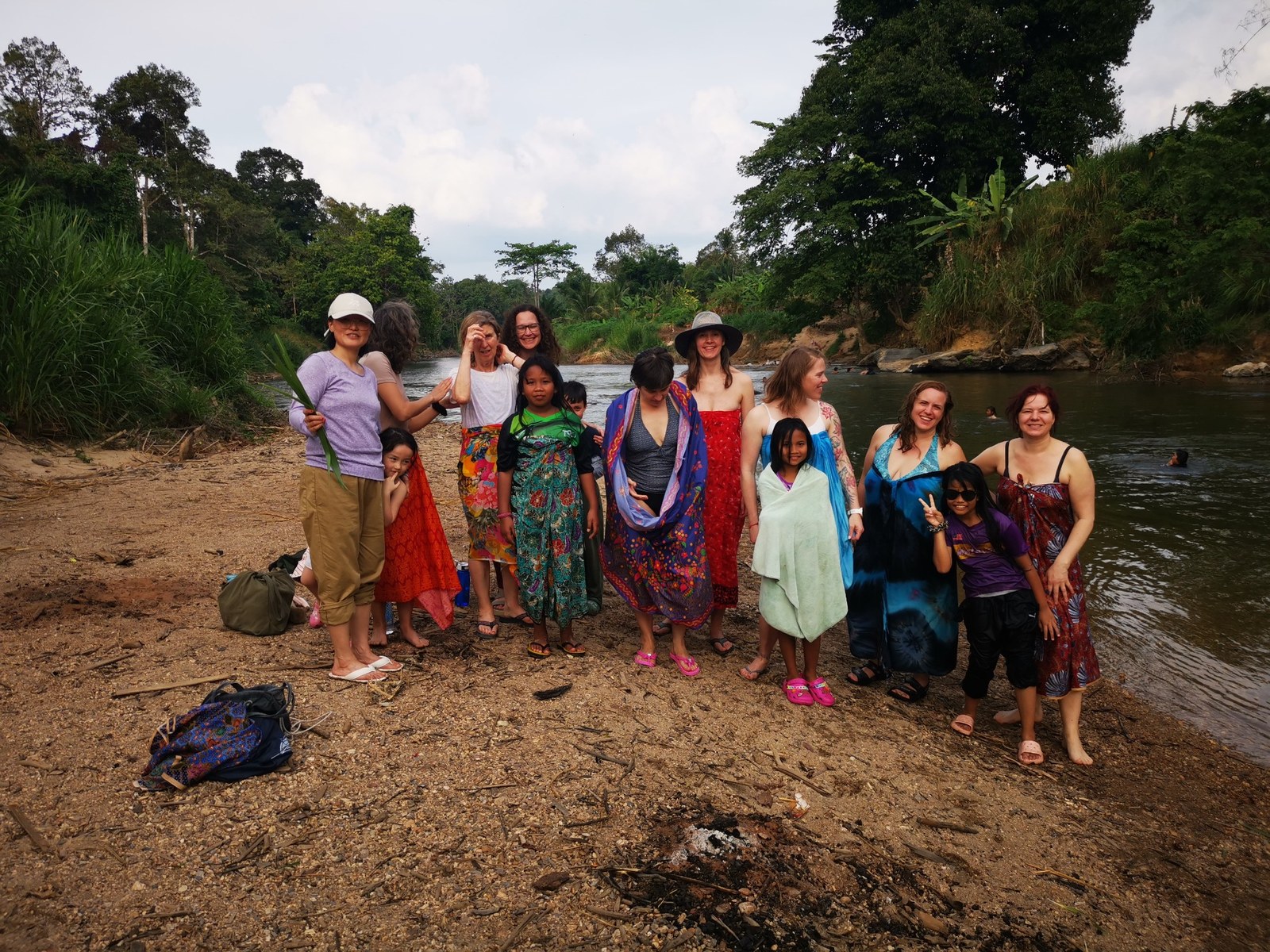 NDP students and Temiar friends gathered together beside a river