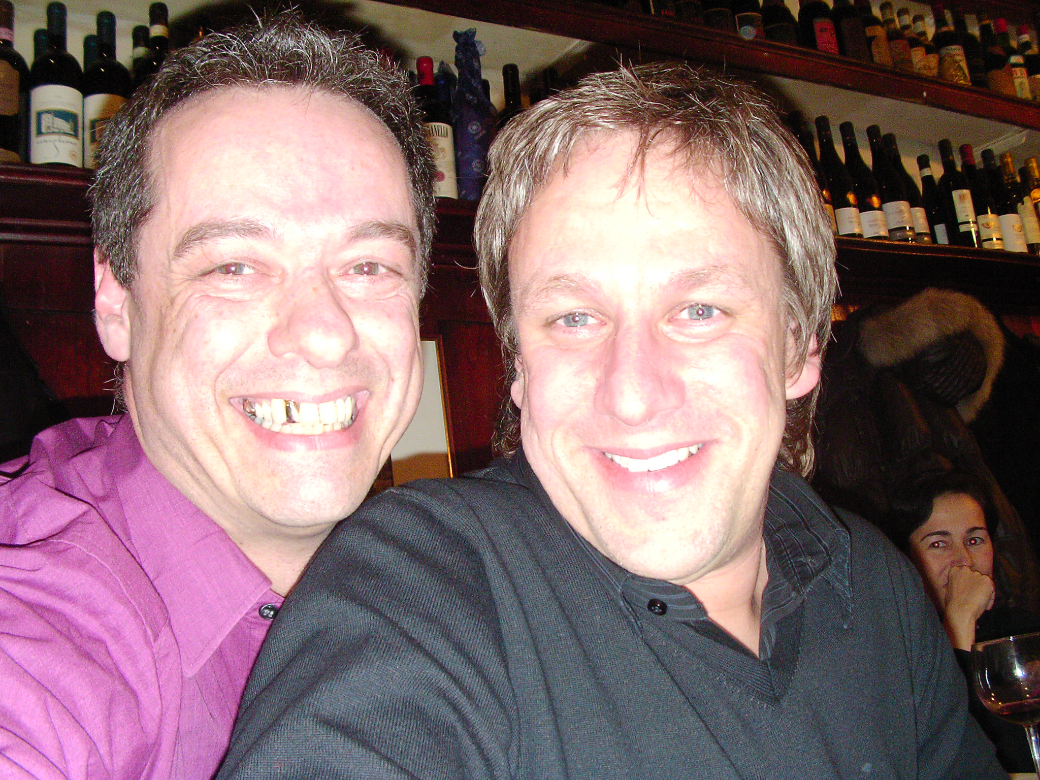 Two friends smiling in a close up photograph