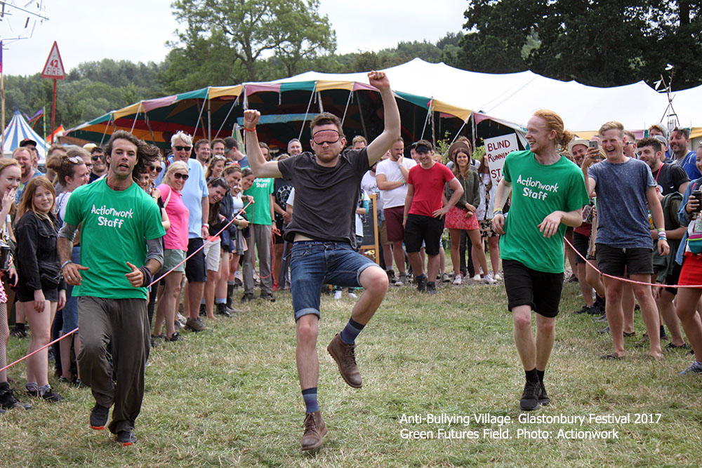 People taking part in blind running at Glastonbury Festival