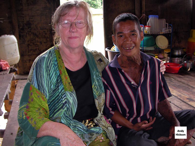 Sue sitting with Jennings in a domestic setting