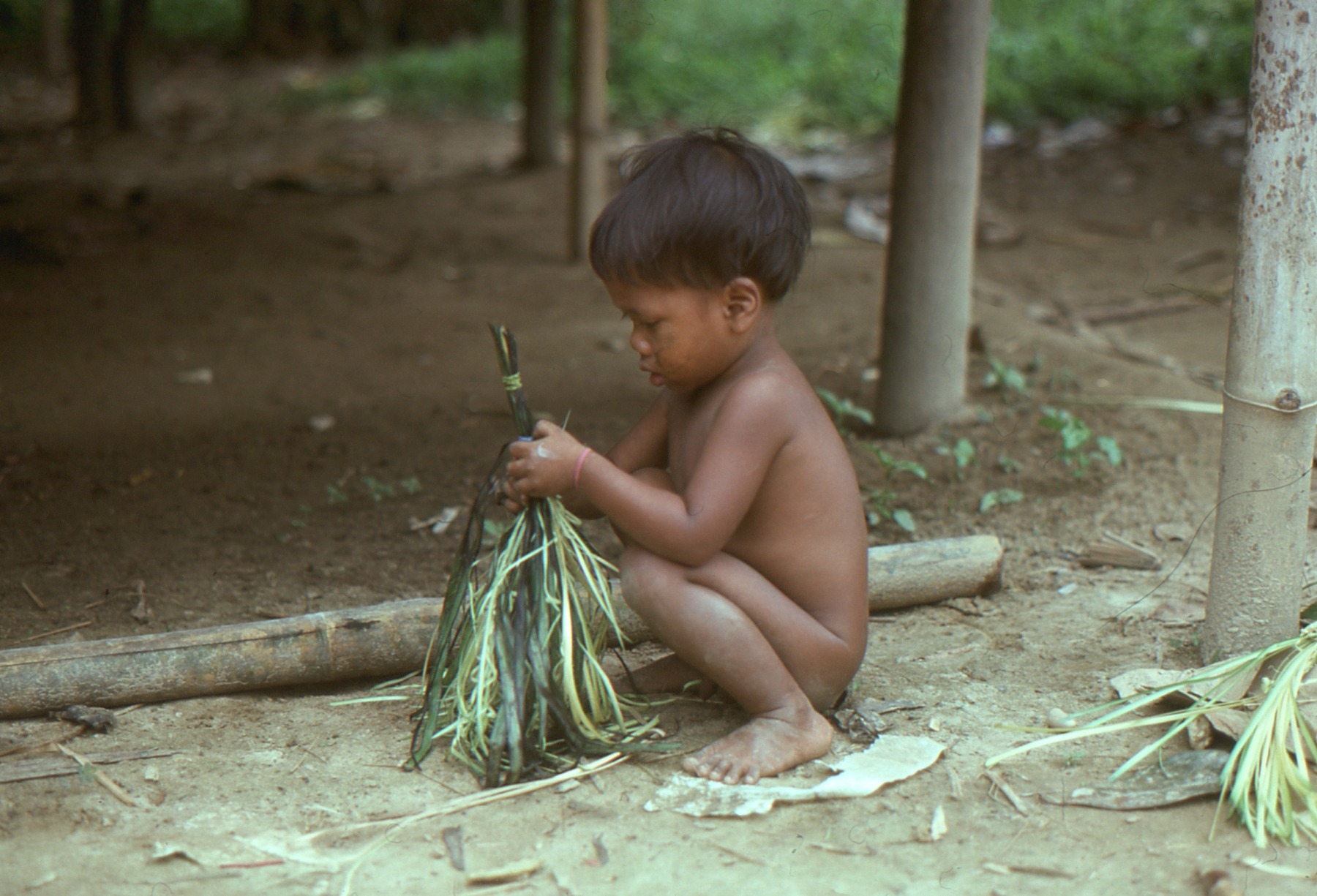 A Temiar child playing with remnants from the previous night’s gabag in Kelantan in the 1970s