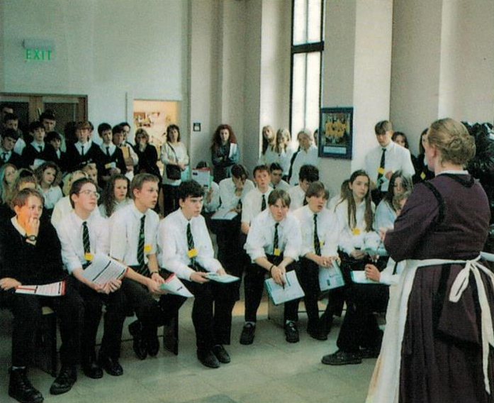 Sue performing as Elizabeth Garrett Anderson before a school audience