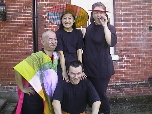 Cast members from Two Becomes One posing outdoors